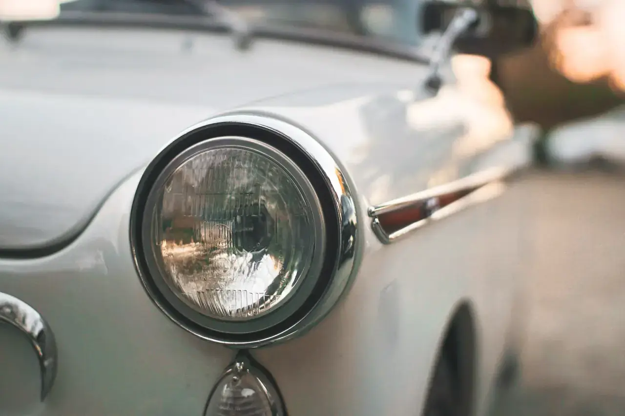 Close macro study of a car headlight lens and reflector.