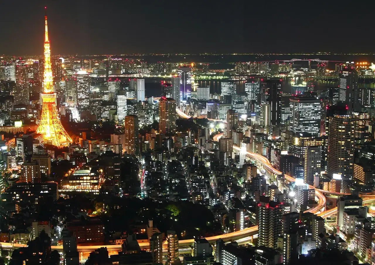 Tokyo Tower illuminated at night.